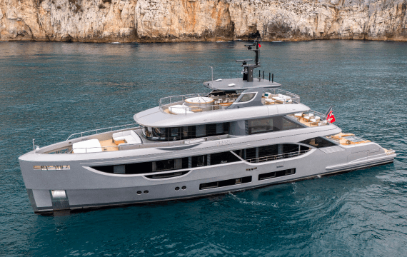 White motor yacht moored in a marina